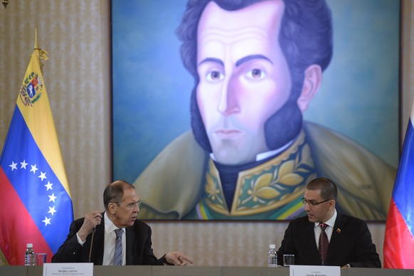 Russia&#039;s Foreign Minister Sergey Lavrov, left, talks to Venezuela&#039;s Foreign Minister Jorge Arreaza during a meeting to discuss bilateral issues in Caracas, Venezuela, Friday, Feb. 7, 2020. ( ...