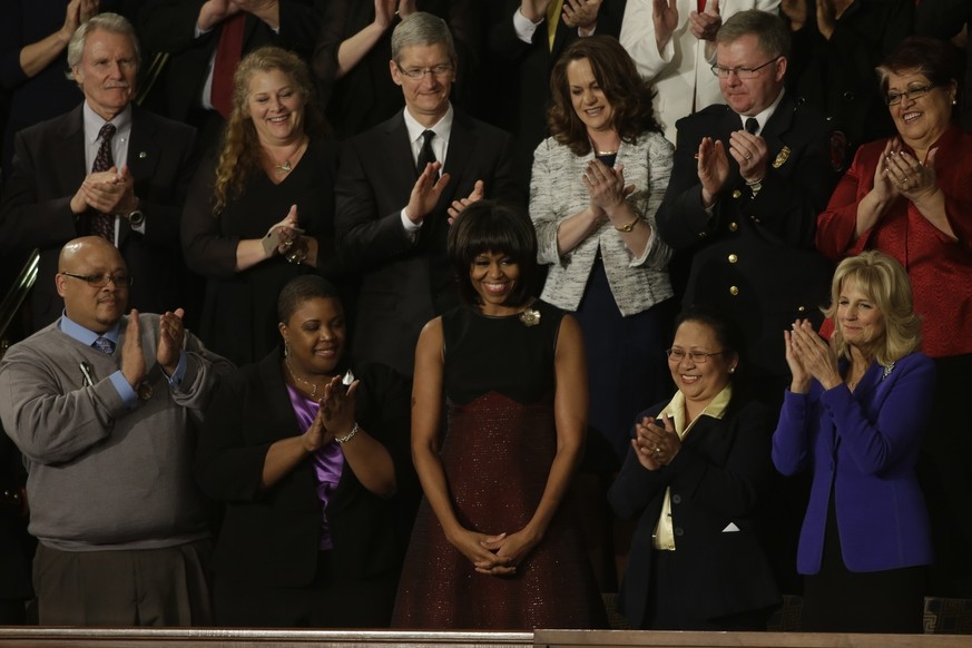 First lady Michelle Obama is applauded before President Barack Obama&#039;s State of the Union address during a joint session of Congress on Capitol Hill in Washington, Tuesday Feb. 12, 2013. Front ro ...