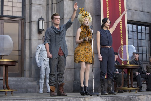This image released by Lionsgate shows Josh Hutcherson as Peeta Mellark, from left, Elizabeth Banks as Effie Trinket and Jennifer Lawrence as Katniss Everdeen in a scene from &quot;The Hunger Games: C ...