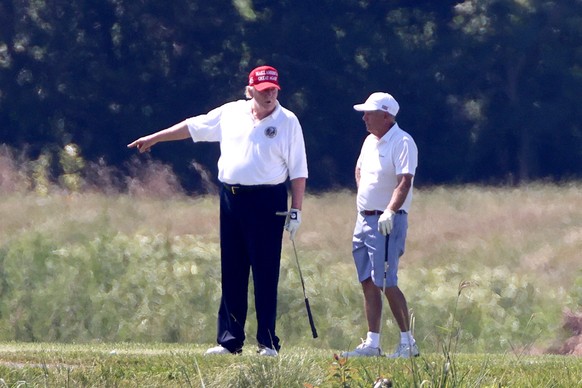 epa08939648 (FILE) US President Donald J. Trump (L), alongside Republican Senator from South Carolina Lindsey Graham (R), play golf at the Trump National Golf Club in Sterling, Virginia, USA, 18 July  ...