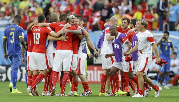 Swiss players celebrate after the group E World Cup soccer match between Switzerland and Ecuador at the Estadio Nacional in Brasilia, Brazil, Sunday, June 15, 2014. Switzerland won the match 2-1. (AP  ...