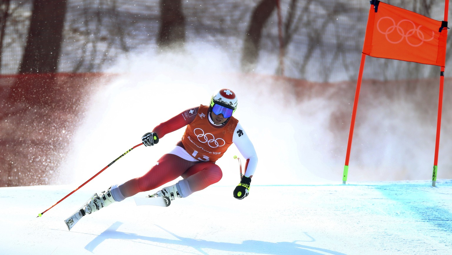 Switzerland&#039;s Beat Feuz competes in men&#039;s downhill training at the 2018 Winter Olympics in Jeongseon, South Korea, Friday, Feb. 9, 2018. (AP Photo/Alessandro Trovati)