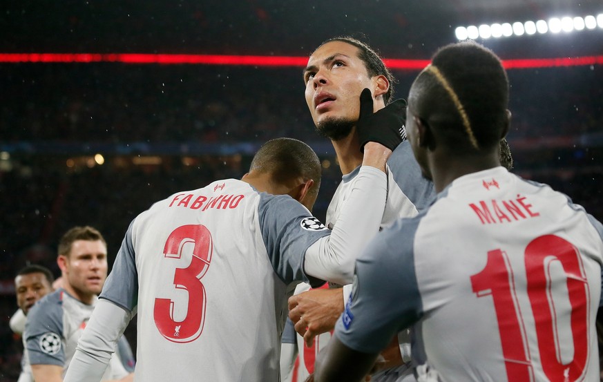 epa07435081 Virgil van Dijk of Liverpool (C) celebrates scoring the second goal during the UEFA Champions League round of 16 second leg soccer match between FC Bayern Munich and Liverpool FC in Munich ...