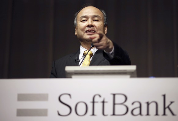 FILE - In this Nov. 4, 2014 file photo, SoftBank founder and Chief Executive Officer Masayoshi Son speaks during a news conference in Tokyo. Softbank and China&#039;s top ride-hailing firm Didi Chuxin ...