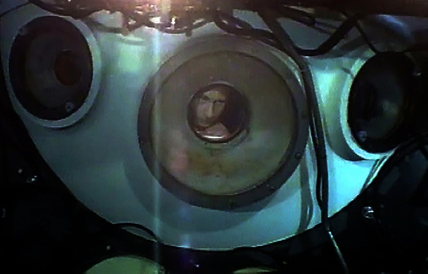 In this image taken from video which was filmed with camera fixed on the Mir-2 mini-submersible, showing Russian Prime Minister Vladimir Putin as he looks through a porthole of Mir-2 during a dive int ...