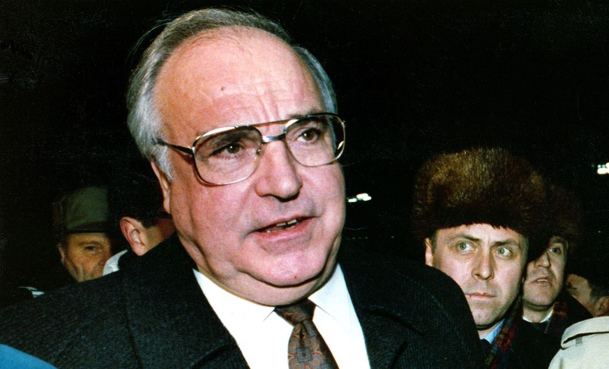 FILE - In this Feb. 10, 1990 file photo then German Chancellor Helmut Kohl, left, and then Foreign Minister Hans-Dietrich Genscher speak during an interview in Moscow, Russia. Genscher died Friday, Ap ...
