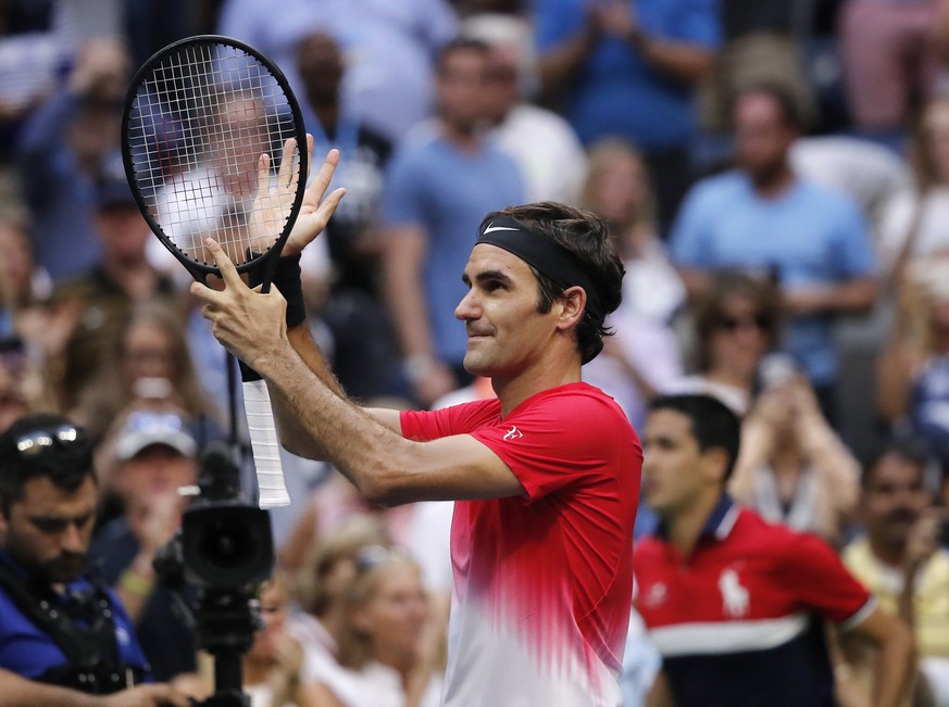 Roger Federer, of Switzerland, reacts after defeating Mikhail Youzhny, of Russia, during the second round of the U.S. Open tennis tournament, Thursday, Aug. 31, 2017, in New York. (AP Photo/Andres Kud ...