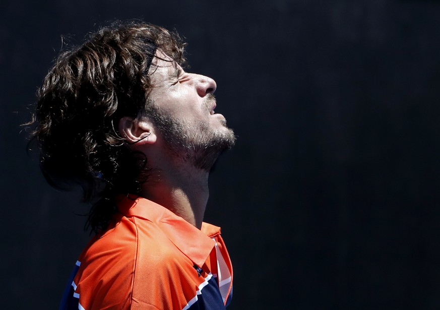 Spain&#039;s Feliciano Lopez grimaces while playing United States&#039; Sam Querrey during their first round match at the Australian Open tennis championships in Melbourne, Australia, Tuesday, Jan. 16 ...