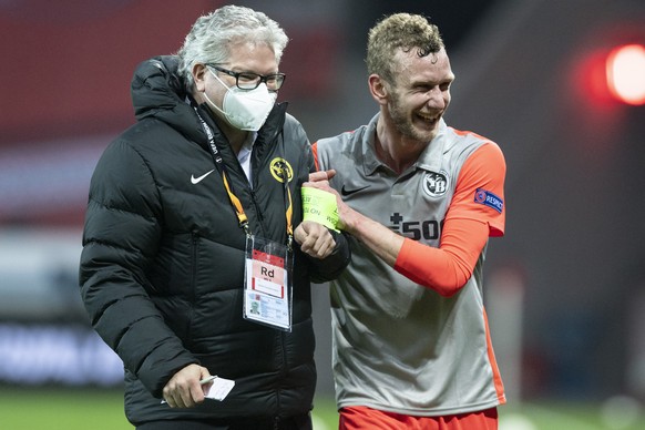 YB&#039;s Fabian Lustenberger, right, and Albert Staudenmann, head of communication react after the round of 32, 2nd leg UEFA Europa League match between Germany&#039;s Bayer 04 Leverkusen and Switzer ...