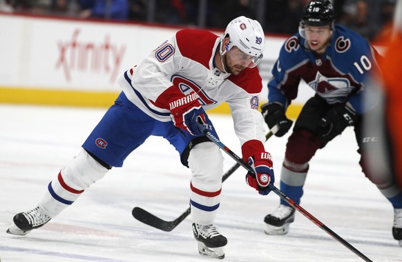 Montreal Canadiens left wing Tomas Tatar, front, drives past Colorado Avalanche right wing Sven Andrighetto in the second period of an NHL hockey game Wednesday, Dec. 19, 2018, in Denver. (AP Photo/Da ...