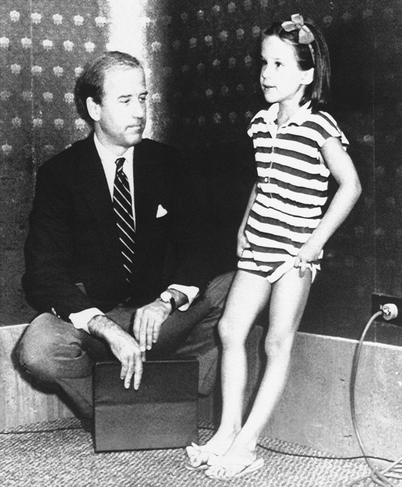 In this Aug. 1, 1987, photo, six-year-old Ashley Biden, daughter of Sen. Joe Biden, D-Del., gets a taste of campaigning with her dad, in Des Moines, Iowa. Barack Obama named Biden as his vice presiden ...