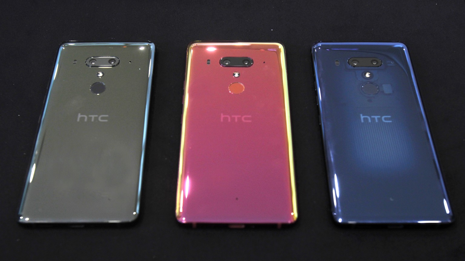 This photo shows three colors of HTC U12+ smart phones during a media event in Taipei, Taiwan, Wednesday, May 23, 2018. The HTC U12+ sell for NT$23,900 (6GB RAM / 64GB ROM, US$797) and NT$24,900 (6GB  ...