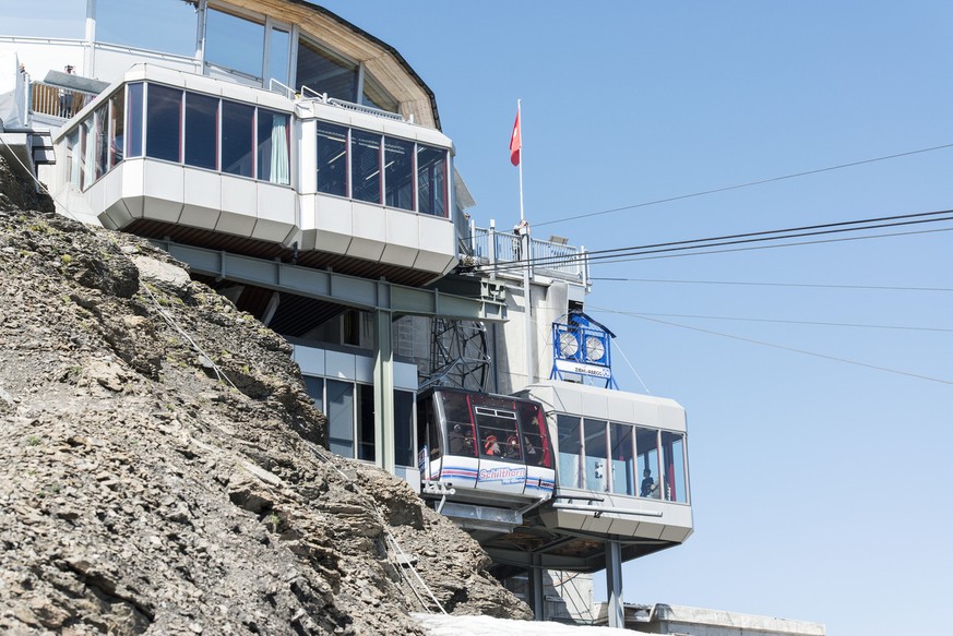 The Schilthornbahn cable car on the way to the summit, pictured on August 6, 2013, on Mount Schilthorn in Muerren, Switzerland. Mount Schilthorn with the revolving restaurant Piz Gloria was a filming  ...