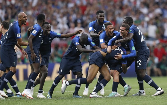 French players celebrate at the end of the final match between France and Croatia at the 2018 soccer World Cup in the Luzhniki Stadium in Moscow, Russia, Sunday, July 15, 2018. France won 4-2. (AP Pho ...