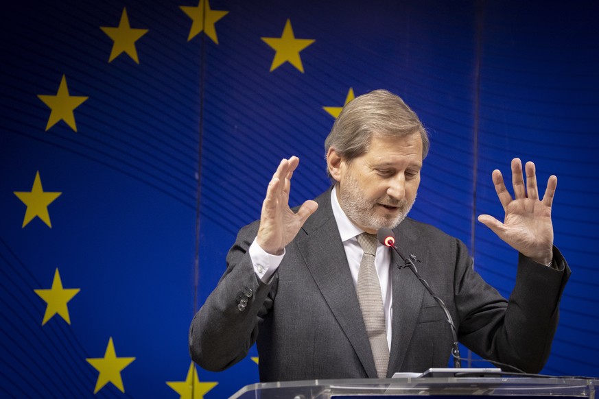 epa07206483 EU commissioner for Enlargement Negotiations Johannes Hahn gestures during a press conference following his meetings with local leaders in Pristina, Kosovo, 03 December 2018. EU commission ...