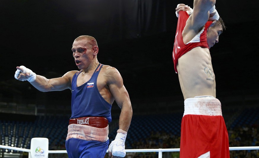 2016 Rio Olympics - Boxing - Quarterfinal - Men&#039;s Bantam (56kg) Quarterfinals Bout 223 - Riocentro - Pavilion 6 - Rio de Janeiro, Brazil - 16/08/2016. Vladimir Nikitin (RUS) of Russia reacts next ...