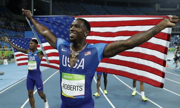 United States&#039; Tony McQuay, left, and Gil Roberts celebrate winning the gold medal in the men&#039;s 4 x 400-meter relay final during the athletics competitions of the 2016 Summer Olympics at the ...