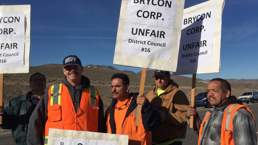 Picketers protest at the Tesla Gigafactory site Monday, Feb. 29, 2016, near Reno, Nev. Hundreds of union construction workers walked off the job at Tesla Motors&#039; battery manufacturing plant in no ...