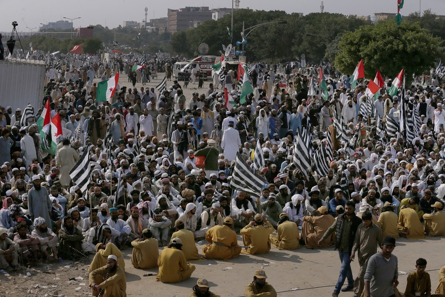 Supporters of Jamiat Ulema-e-Islam party listen to their leaders during an anti-government march in Islamabad, Pakistan, Saturday, Nov. 2, 2019. Tens of thousands of Islamists remained in a protest ca ...