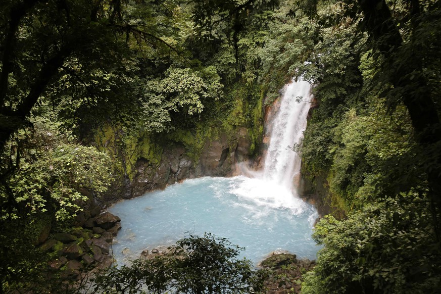 epa05509120 A picture made available on 24 August 2016 shows a waterfall at the Volcan Tenorio Park in Guanacaste, Costa Rica, 20 August 2016. Costa Rica, with an area of 51,100 square kilometers, 26  ...