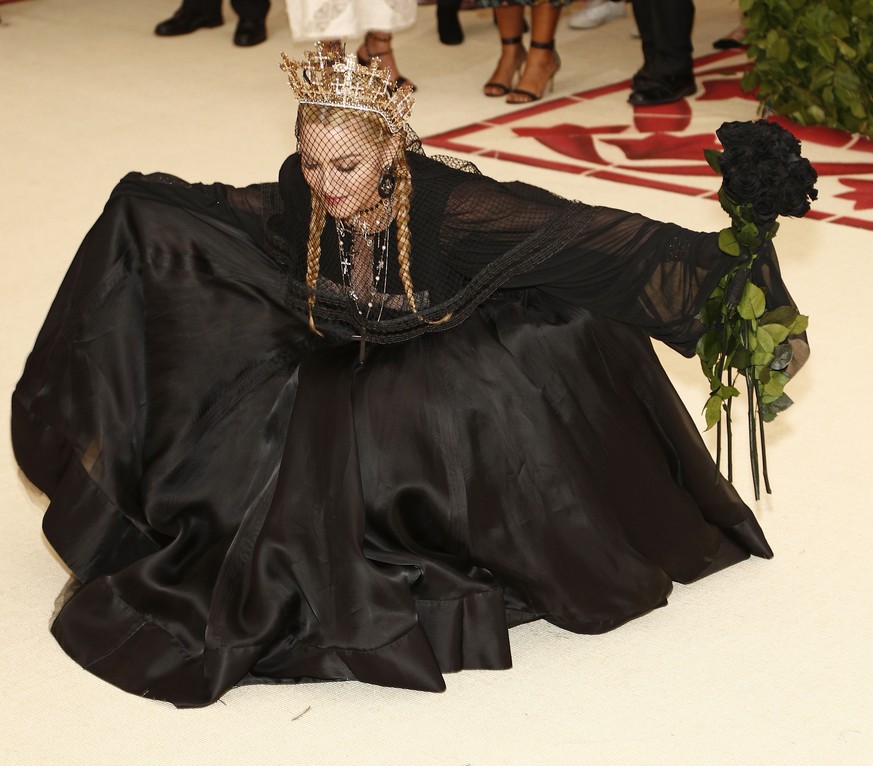 epa06718076 Madonna arrives on the red carpet for the Metropolitan Museum of Art Costume Institute's benefit celebrating the opening of the exhibit "Heavenly Bodies: Fashion and the Catholic ...