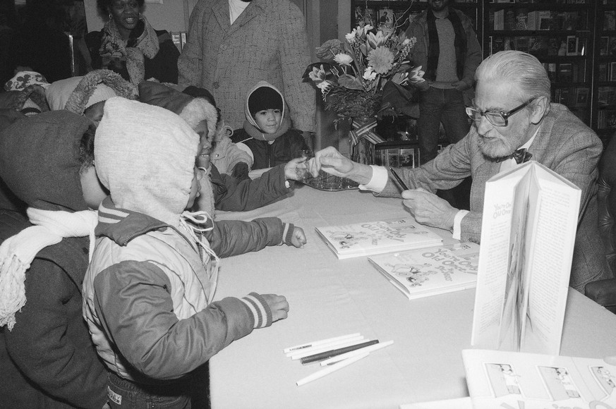 FILE - In this Feb. 27, 1986, file photo, Theodor Seuss Geisel, known as Dr. Seuss, talks to some children with his book &quot;You&#039;re Only Old Once!&quot; at Barnes and Noble in New York. A Dr. S ...