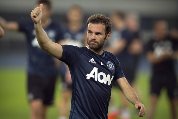 Manchester United&#039;s Juan Mata gives a thumbs up to the crowd after the team&#039;s training session at the Olympic Sports Center Stadium in Beijing, Sunday, July 24, 2016. Manchester United will  ...