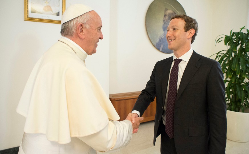 Pope Francis shakes hands with Facebook CEO Mark Zuckerberg during a meeting at the Vatican August 29, 2016. Osservatore Romano/Handout via Reuters ATTENTION EDITORS - THIS IMAGE WAS PROVIDED BY A THI ...