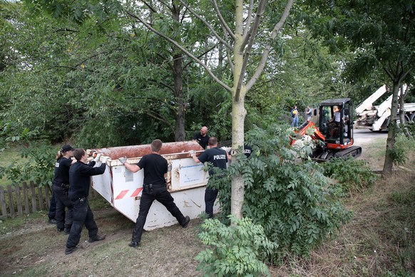 epa08572753 Police officers dig and search a garden plot in Hannover, northern Germany, 29 July 2020. Police is working on the site in relation to the investigation of the Madeleine &#039;Maddie&#039; ...