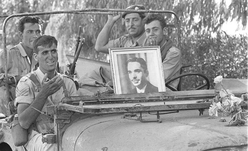 (Jordanian soldiers carry a portrait of King Hussein in their jeep in this photo taken in June 1967. According to reports, the six-day war was decided on 02 June 1967 during a meeting between the Isra ...