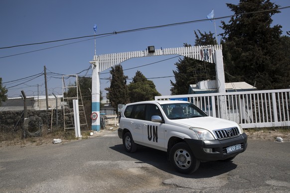 epa06925586 UN car leaves the UN base in Quneitra next to the Israeli-Syrian border in the Golan Heights, 03 August 2018. According to a Russian Defense Ministry spokesman, UN peacekeepers have return ...