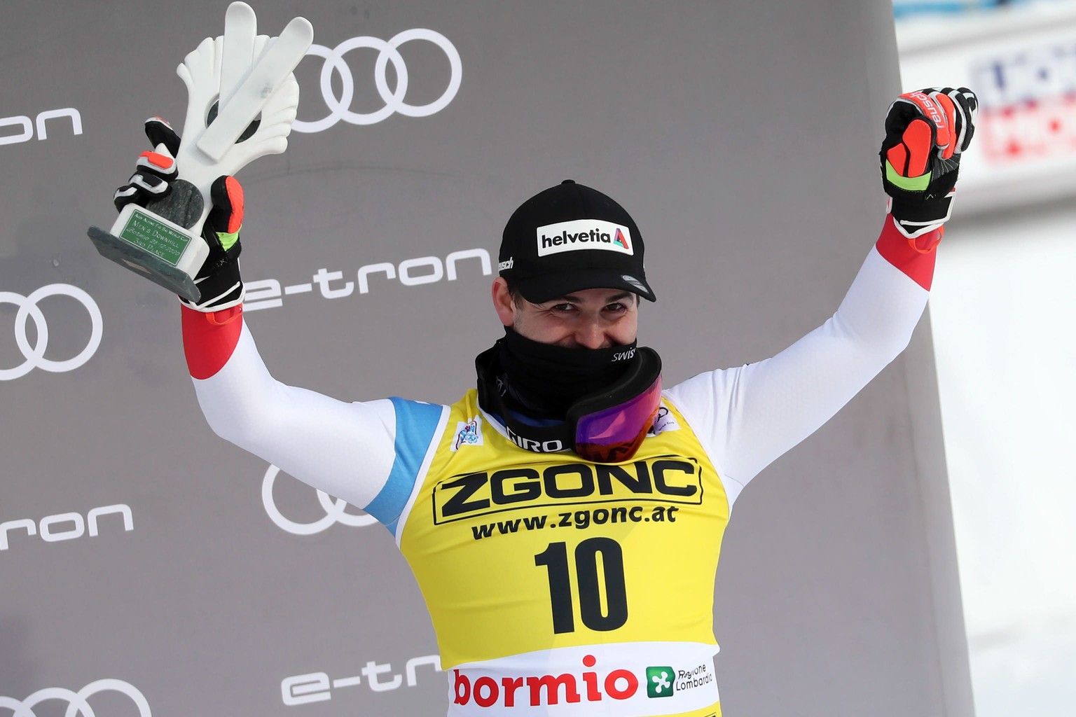 epa08911251 Third placed Urs Kryenbuehl of Switzerland celebrates on the podium after the Men&#039;s Downhill race at the FIS Alpine Skiing World Cup event in Bormio, Italy, 30 December 2020. EPA/ANDR ...