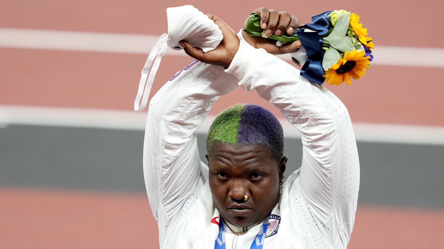 epa09385224 Silver medalist Raven Saunders of the USA during the medal ceremony for the Women&#039;s shot put during the Athletics events of the Tokyo 2020 Olympic Games at the Olympic Stadium in Toky ...