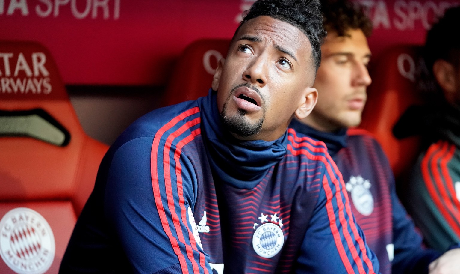 epa07488946 Bayern&#039;s Jerome Boateng (L) sits on the substitutes bench during the German Bundesliga soccer match between FC Bayern Munich and Borussia Dortmund in Munich, Germany, 06 April 2019. E ...