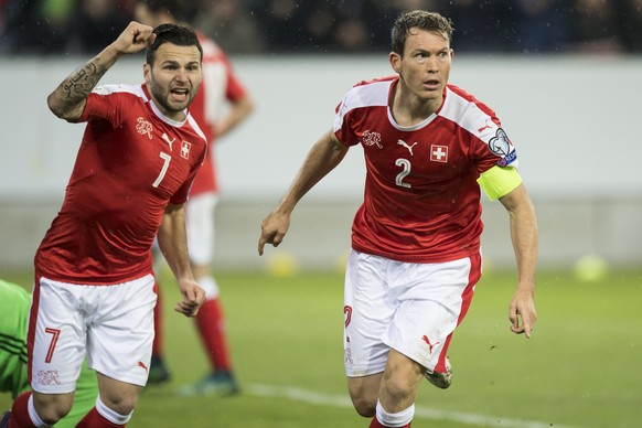 Swiss defender Stephan Lichtsteiner, right, celebrates after scoring a goal with Swiss forward Renato Steffen, left, during the 2018 Fifa World Cup group B qualification soccer match between Switzerla ...