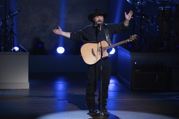 FILE - In this March 4, 2020, file photo, Garth Brooks performs on stage during the 2020 Gershwin Prize Honoree&#039;s Tribute Concert at the DAR Constitution Hall in Washington. (Photo by Brent N. Cl ...
