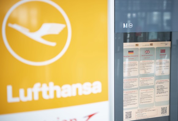 epa08179149 An information about coronavirus, possible symptoms and behavior patterns on a display at the Airport in Munich, Germany, 30 January 2020. Lufthansa announced on Wednesday 29 January that  ...