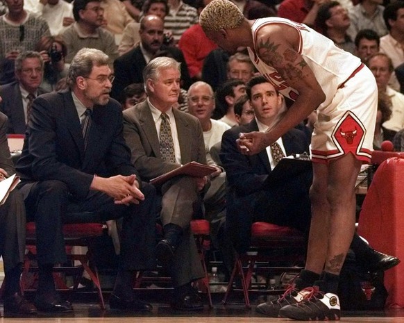 Chicago Bulls&#039; Dennis Rodman pleads his case with coach Phil Jackson after he received an early technical foul during the first quarter of Game 2 with the Miami Heat in the Eastern Conference fin ...