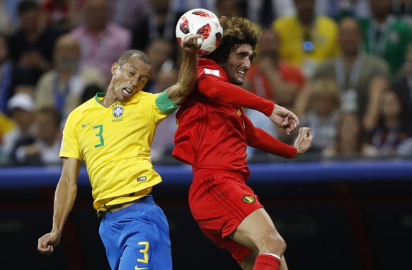 Brazil&#039;s Miranda, left, and Belgium&#039;s Marouane Fellaini go for a header during the quarterfinal match between Brazil and Belgium at the 2018 soccer World Cup in the Kazan Arena, in Kazan, Ru ...