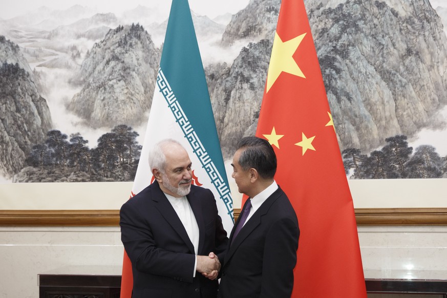 Chinese Foreign Minister Wang Yi meets Iranian Foreign Minister Mohammad Javad Zarif at the Diaoyutai State Guesthouse in Beijing, Friday, May 17, 2019. (Thomas Peter/Pool Photo via AP)