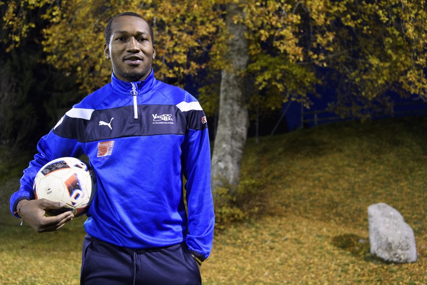 Cameroonian soccer player Eric Djemba-Djemba poses with a ball before a training session with the FC Vallorbe-Ballaigues, in Ballaigues, Switzerland, on Thursday, November 3, 2016. The former player o ...