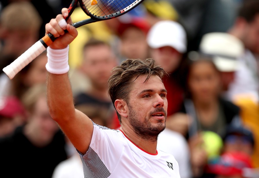 epa07610535 Stan Wawrinka of Switzerland reacts after winning against Cristian Garin of Chile their men’s second round match during the French Open tennis tournament at Roland Garros in Paris, France, ...