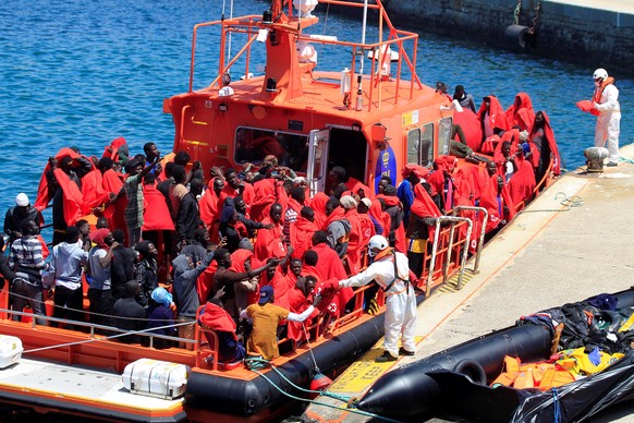 epa06908182 Some of the 238 Sub-Saharan migrants rescued in the waters of the Strait of Gibraltar by Arcturus, Denebola and Concepción Arenal Spanish rescue ships, while trying to reach the Spanish co ...