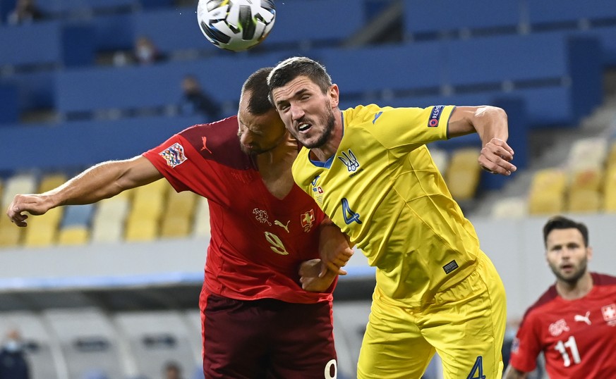 Switzerland&#039;s forward Haris Seferovic, left, fights for the ball with Ukraine&#039;s defender Serhiy Kryvtsov, right, during the UEFA Nations League group 4 soccer match between Ukraine and Switz ...