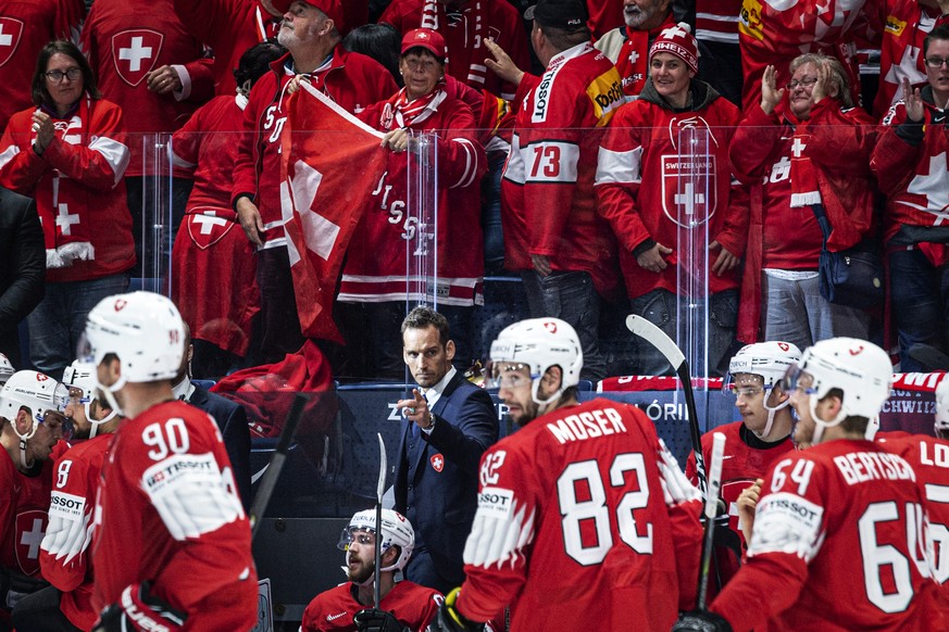Switzerland`s coach Patrick Fischer celebrates with the team after scoring 2:0 during the game between Switzerland and Austria, at the IIHF 2019 World Ice Hockey Championships, at the Ondrej Nepela Ar ...