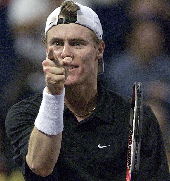 SHA12 - 20021116 - SHANGHAI, CHINA : The world number one ranked player Australian Lleyton Hewitt celebrates after winning the semi final match against Swiss Roger Federer in the Tennis Masters Cup in ...