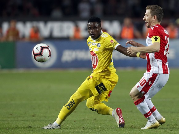 HJK Helsinki&#039;s Evans Mensah, left, duels for the ball with Red Star&#039;s Marko Marin during the Champions League second qualifying round, first leg soccer match between Red Star and HJK Helsink ...