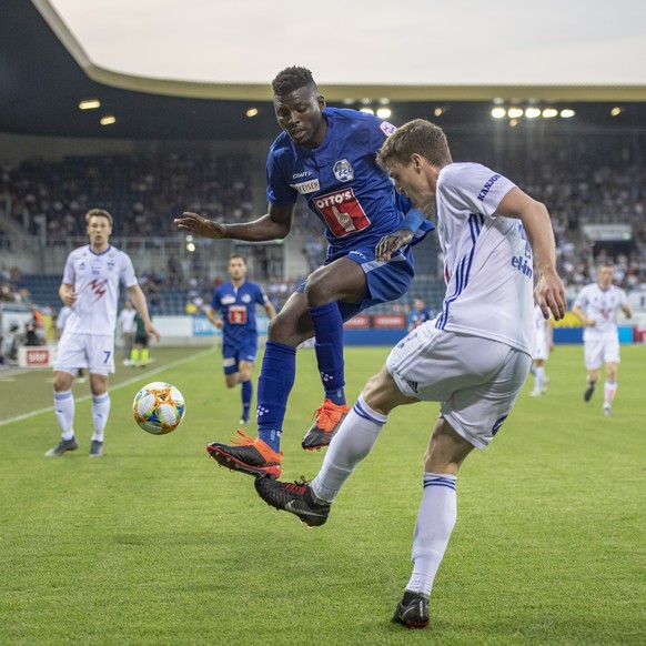 Eric Tia, left, from FC Luzern and Deni Pavlovic, right, from KI Klaksvik at the Europa League Qualification game, round 2 match between Switzerlands`s FC Luzern and Faroe Islands Team of KI Klaksvik  ...