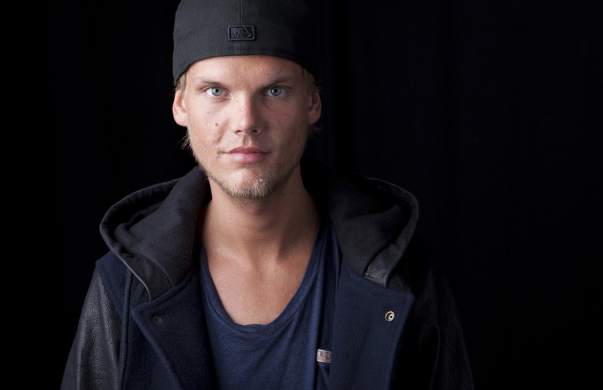 FILE - In this Aug. 30, 2013 file photo, Swedish DJ, remixer and record producer Avicii poses for a portrait, in New York. Avicii first posthumous single will be released next week and a full album wi ...