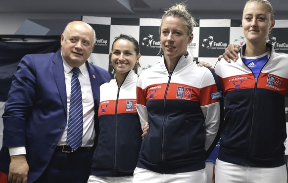 Left to right, head of the French Tennis Federation Bernard Giudicelli, team members Amandine Hesse, Pauline Parmentier, Kristina Mladenovic, captain Yannick Noah, pose for photo after the draw ceremo ...